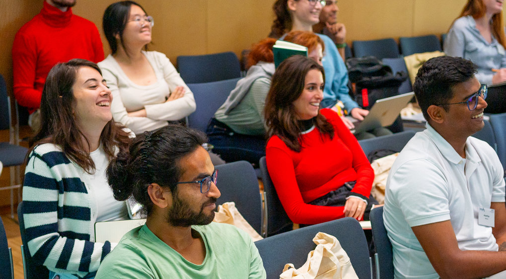 IMPRS-CBP students listen to a talk. They are enjoying themselves.